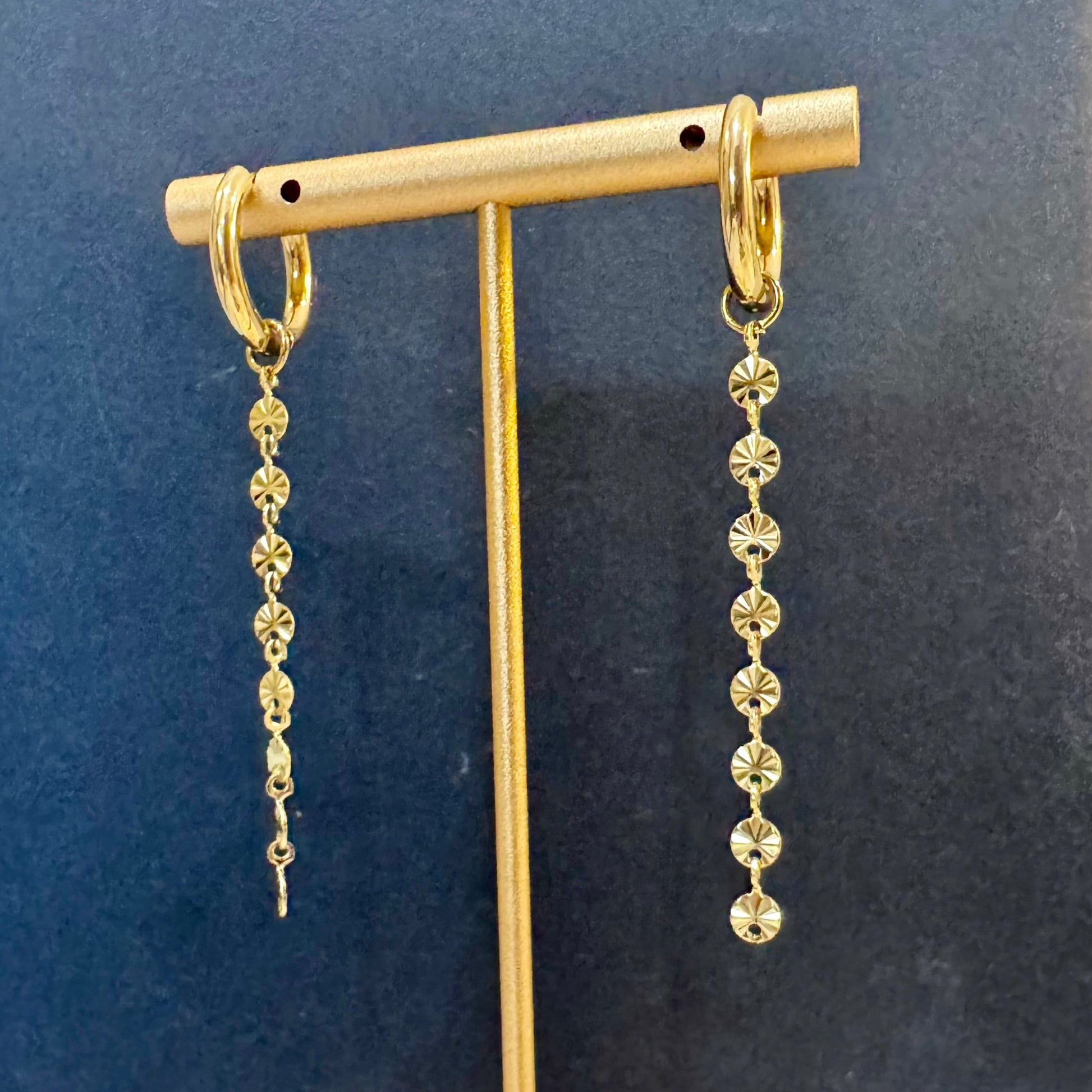 Gold long chain earrings with disc beads textured details 